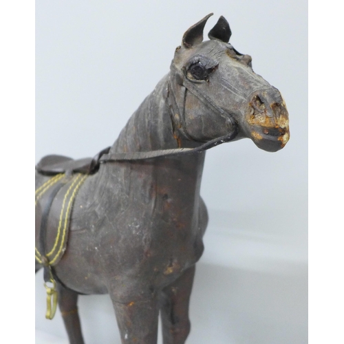 2013 - A leather covered model horse, 32cm, some a/f