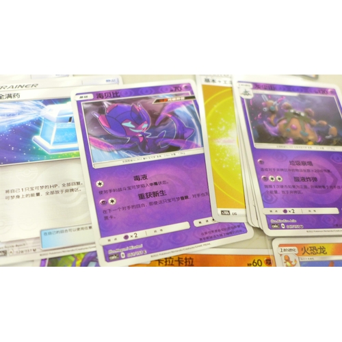 2036 - A collection of over 60 Japanese and Korean holographic Pokemon cards