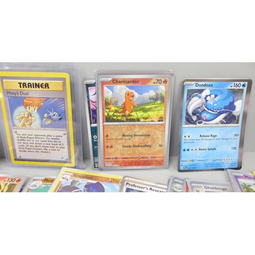 2050 - A large collection of Pokemon cards including holographic and vintage