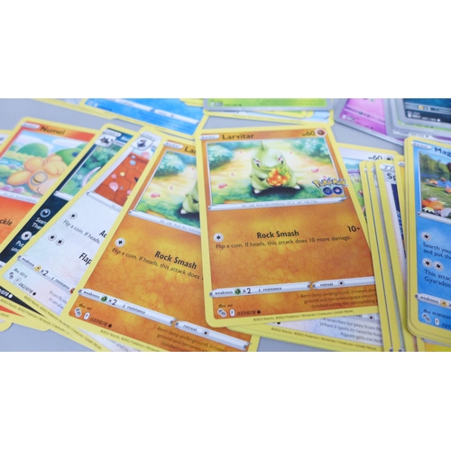 2050 - A large collection of Pokemon cards including holographic and vintage