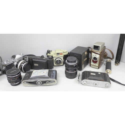 2104 - A collection of cameras; Nikkormat with f=50mm lens, two Vivitar lenses, Kodak Cresta 3 camera, Koda... 