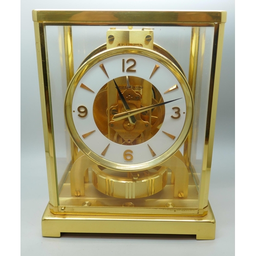 2172 - A Jaeger-LeCoultre Atmos clock, with fitted case, with Garrard & Co. guarantee dated 1976, also with... 