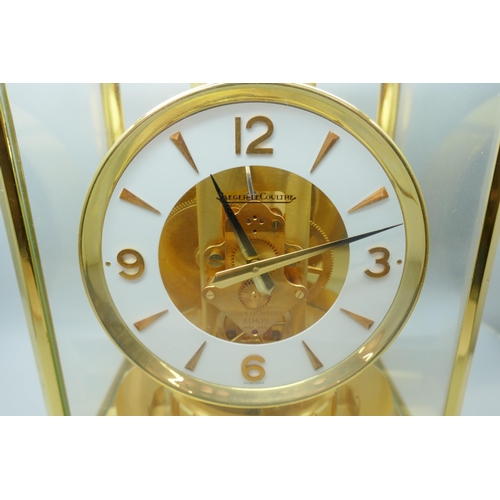 2172 - A Jaeger-LeCoultre Atmos clock, with fitted case, with Garrard & Co. guarantee dated 1976, also with... 