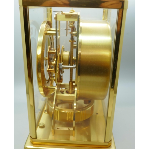 2172 - A Jaeger-LeCoultre Atmos clock, with fitted case, with Garrard & Co. guarantee dated 1976, also with... 