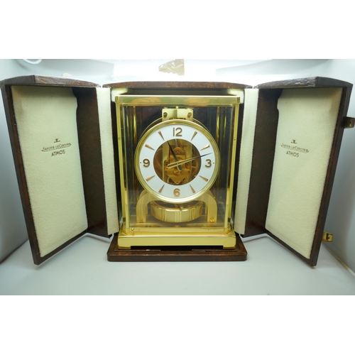 2172 - A Jaeger-LeCoultre Atmos clock, with fitted case, with Garrard & Co. guarantee dated 1976, also with... 