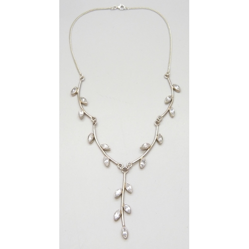 7071 - A silver and topaz necklace and earrings set, 29g,