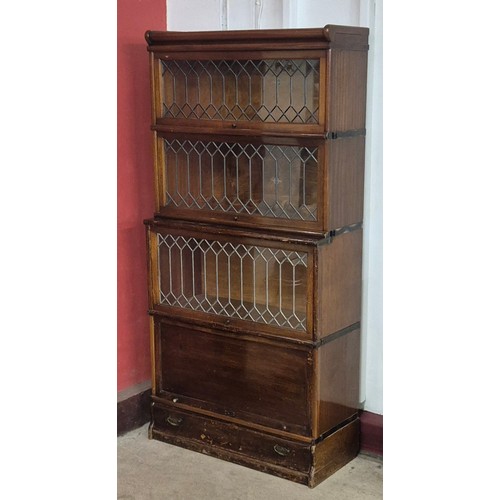 117 - An early 20th Century Globe Wernicke oak four tier sectional stacking bookcase