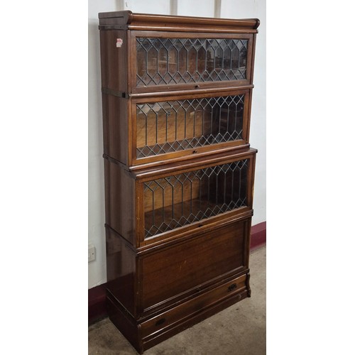 120 - An early 20th Century Globe Wernicke oak four tier sectional stacking bookcase