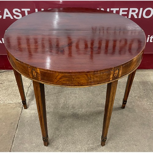 98 - An George III inlaid mahogany demi lune fold over tea table