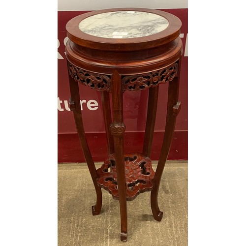 104 - A 19th Century style Chinese hardwood and marble topped jardinière stand