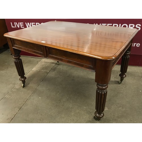 173 - A George IV mahogany two drawer library table