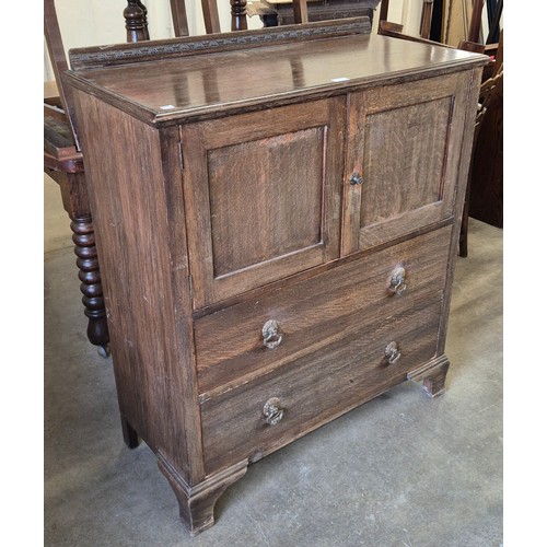 260 - An early 20th Century oak tallboy