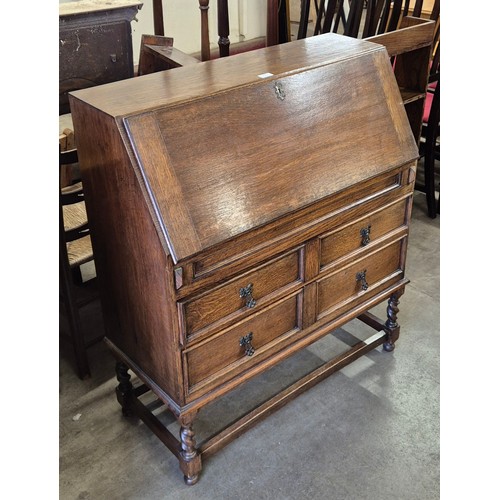 264 - An early 20th Century oak barleytwist bureau