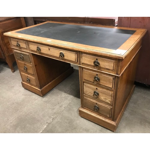 175 - An Arts and Crafts oak pedestal desk