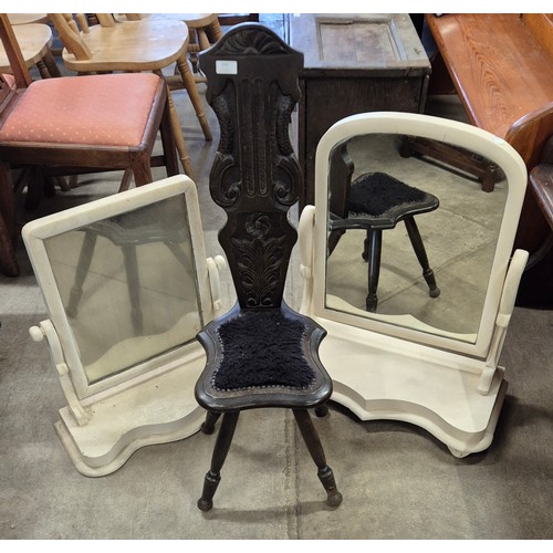 270 - An early 20th Century carved oak spinning chair and two white painted toilet mirrors