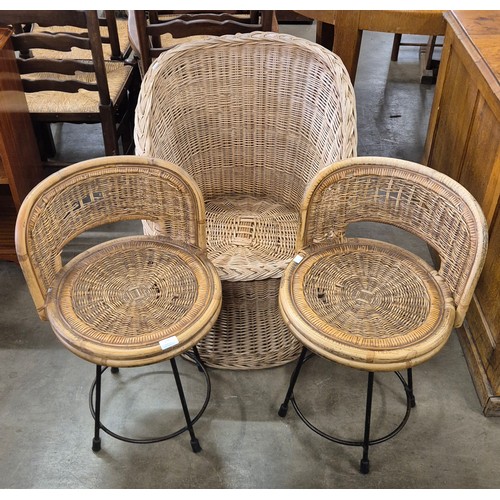 274 - A pair of Italian bamboo and black tubular metal stools and a tub chair