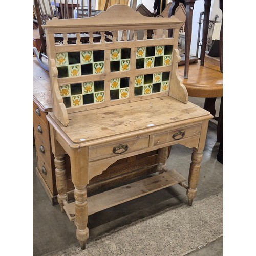 276 - A Victorian pine and tiled back washstand