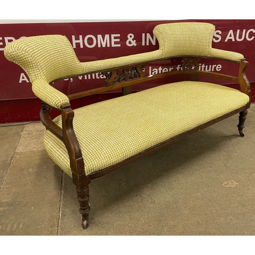 121 - An Edward VII mahogany and fabric upholstered salon settee