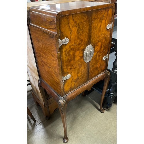 126 - An Art Deco walnut cocktail cabinet