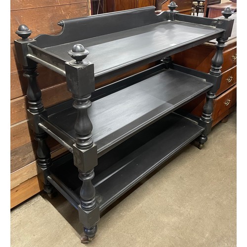 127 - A Victorian ebonised three tier buffet