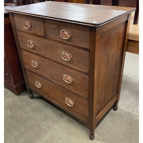 130 - An Arts and Crafts oak chest of drawers