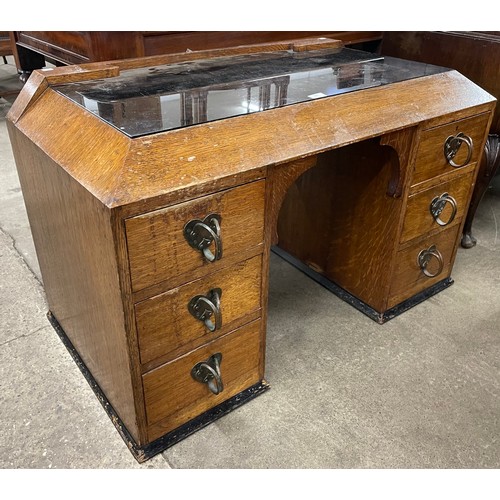 131 - An Arts and Crafts Liberty & Co oak dressing table