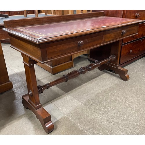 139 - A Victorian mahogany and burgundy leather topped two drawer writing table