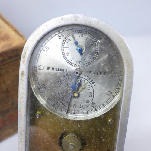 2022 - A small pigeon clock, McMillan’s Patent automatic timing clock, with original postage box, 12cm