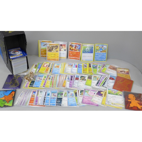 2030 - A large collection of Pokemon cards with holographic, in collectors box