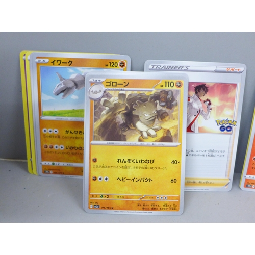 2030 - A large collection of Pokemon cards with holographic, in collectors box