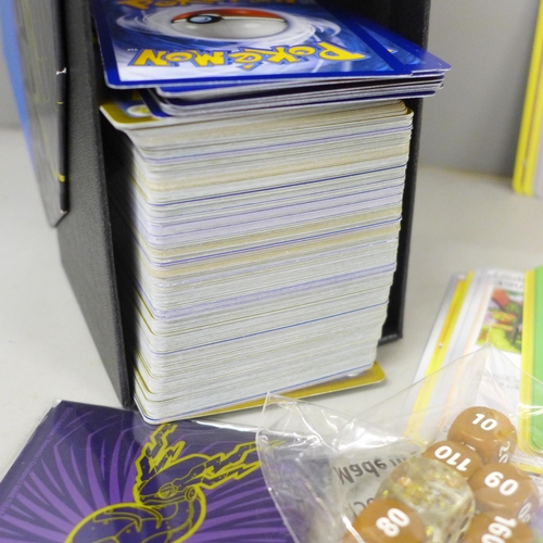 2030 - A large collection of Pokemon cards with holographic, in collectors box