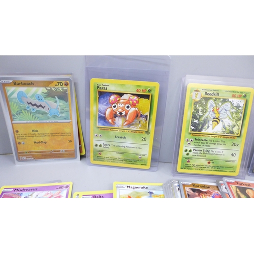 2050 - A large collection of Pokemon cards including holographic and vintage