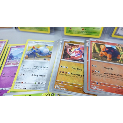 2050 - A large collection of Pokemon cards including holographic and vintage