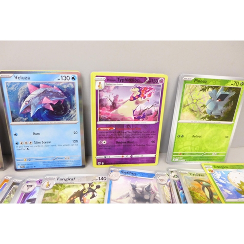 2053 - A collection of over 100 Pokemon cards including rare Black Star