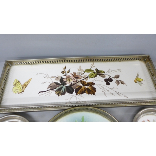 2066 - A collection of ceramic wine coasters and a tray, with floral detail and metal surrounds