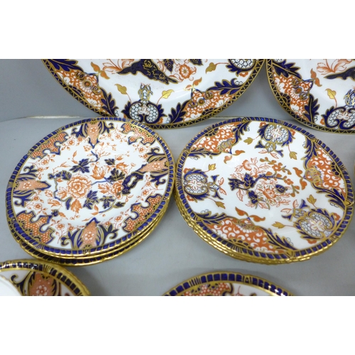 2070 - Royal Crown Derby tea ware, 5 cups, 7 saucers, 8 side plates and two larger plates, (2 cups cracked,... 