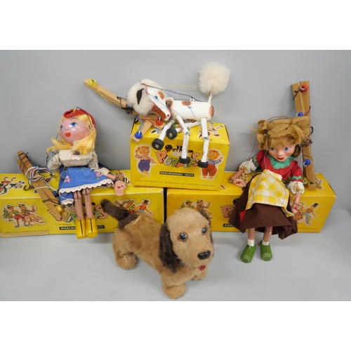 2120 - A collection of toys; three Pelham puppets, four Meercat toys and a dog