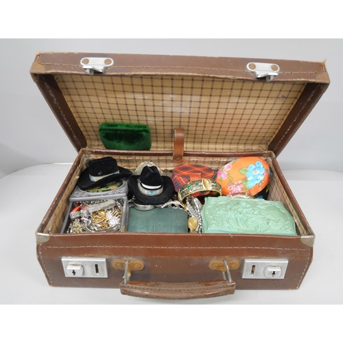 2141 - A case containing earrings, rings, bangles and other costume jewellery