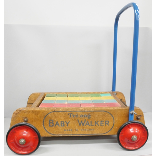 2144 - A vintage circa 1960s Tri-ang baby walker, with brick blocks