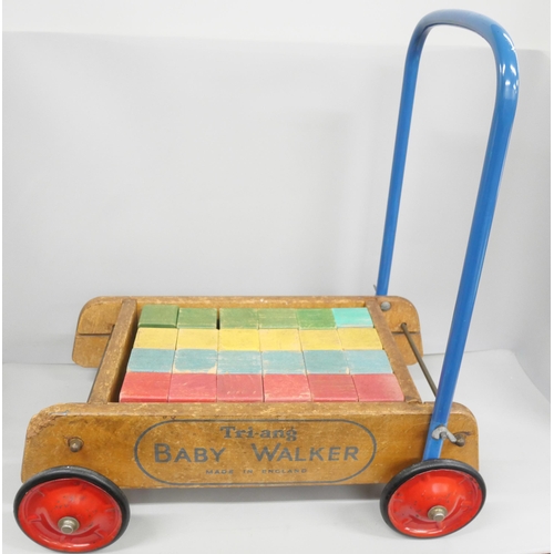 2144 - A vintage circa 1960s Tri-ang baby walker, with brick blocks