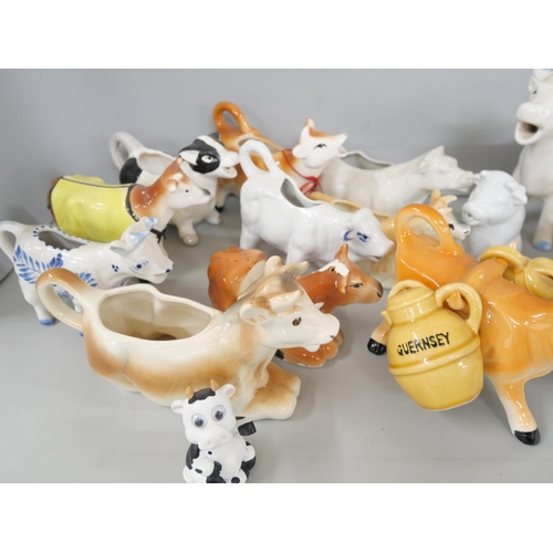 2170 - A collection of ceramic creamers/milk jugs in the form of cows