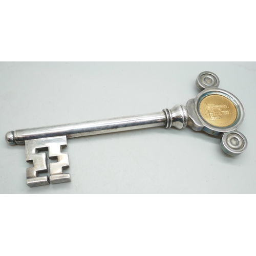 2184 - A large novelty corkscrew bottle opener in the form of a key commemorating the Coronation of Queen E... 