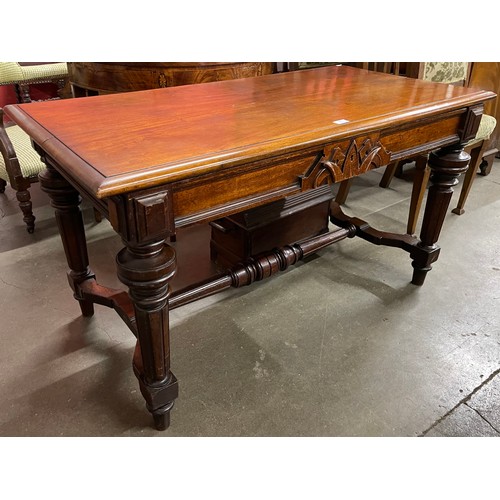 143 - A Victorian mahogany single drawer writing table