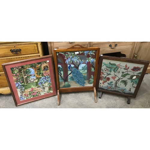 289 - Two oak and embroidered firescreens and a framed embroidery