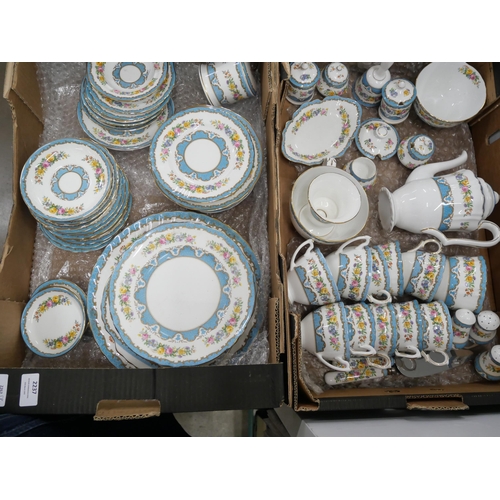 2237 - A collection of bone china Crown Staffordshire tea and dinnerware, in the blue Tunis pattern. Compri... 