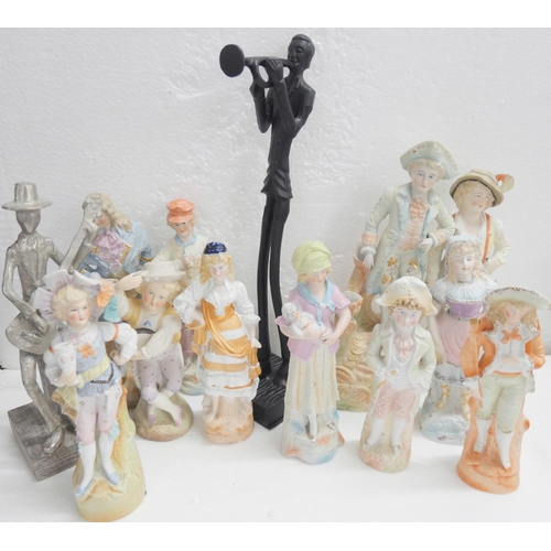 2249 - A large collection of bisque figures together with other contemporary sculptural figures, two hymn b... 