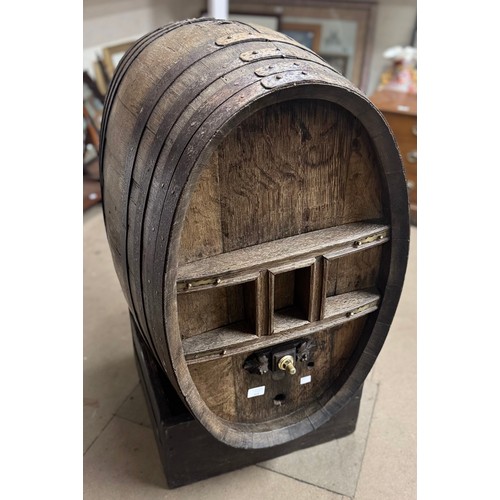 330 - A coopered oak barrel on stand