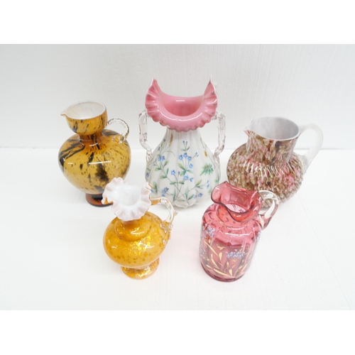 2284 - A collection of five coloured glass vases with some 19th Century blown glass examples. Having mottle... 