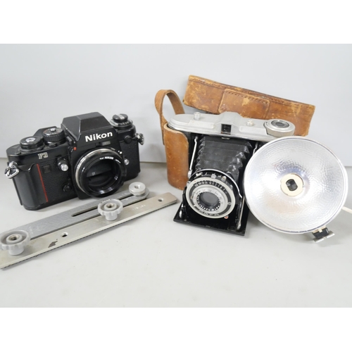 2299 - Two camera bodies, Nikon F3 and Agfa Isolette consisting camera with leather case and flash attachme... 