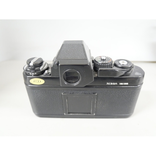 2299 - Two camera bodies, Nikon F3 and Agfa Isolette consisting camera with leather case and flash attachme... 